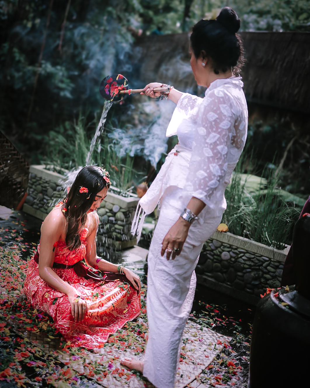 Traveler experiencing Balinese purification ceremony